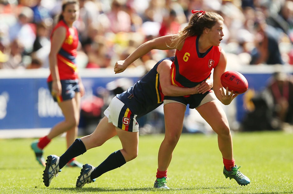 AFL 2016 Media - SANFL All Stars Womens Match MELBOURNE, AUSTRALIA - APRIL 2: Angela Moritz of SA Blue tackles Georgia Bevan of SA Red during the SANFL All Stars Womens match at Adelaide Oval in Adelaide, Australia on April 2, 2016. (Photo by James Elsby/AFL Media)
